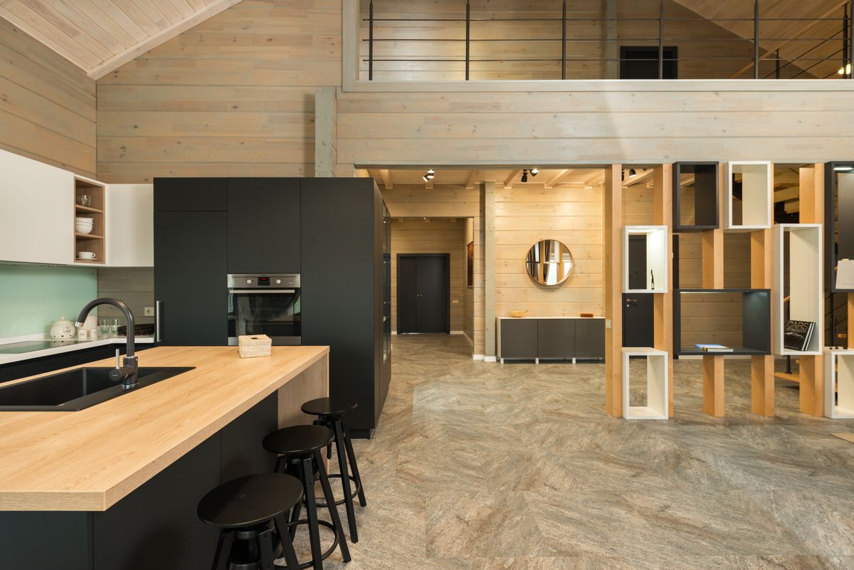 A contemporary kitchen with bespoke cabinetry in a private house