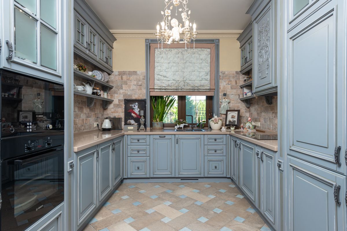 A classic shaker-style kitchen with paneled cabinet doors